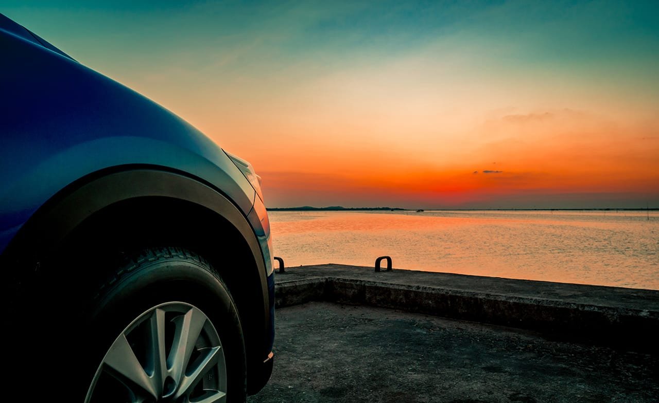Blue compact SUV car with sport and modern design parked on conc